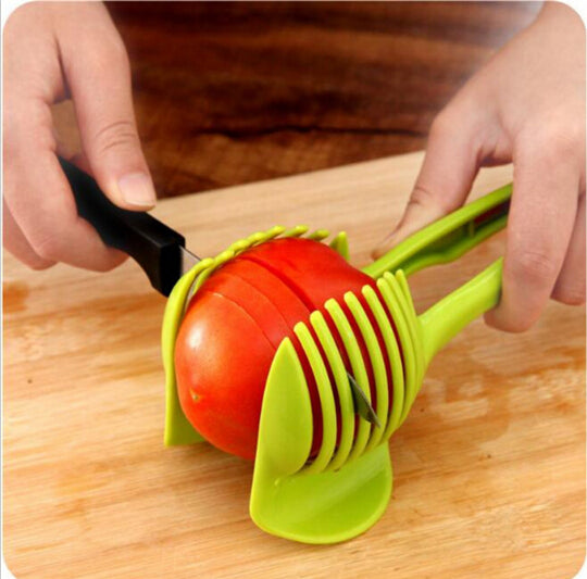https://robsoncreek.com/cdn/shop/products/Handheld-Creative-Kitchen-Fruit-And-Vegetable-Slicer-Orange-Lemon-Cutter-Cake-Clip-Multi-function-Kitchen-Tool_580x.jpg?v=1524285850